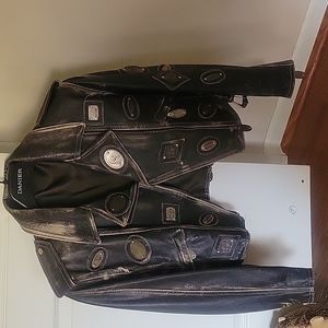 Distressed leather jacket with metal accents